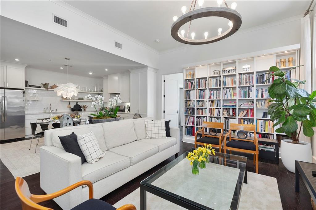 10625 Serenbe Lane, Unit 204 Chattahoochee Hills, GA 30268 - Photo 2 of 20 a living room with furniture and a wooden floor