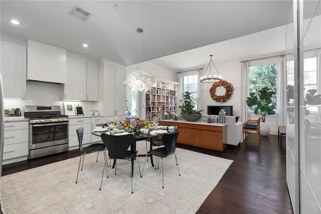 a kitchen with a table and chairs in it