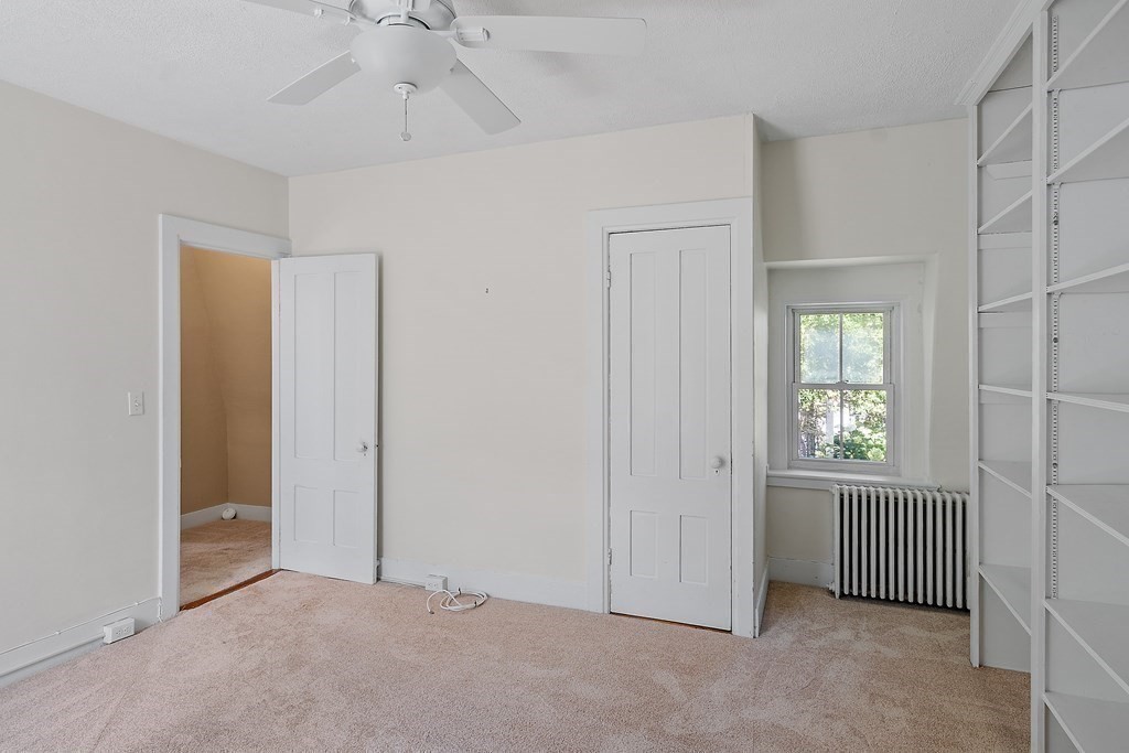 84 A Granite Street, Unit A Rockport, MA 01966 - Photo 12 of 40 an empty room with windows and closet