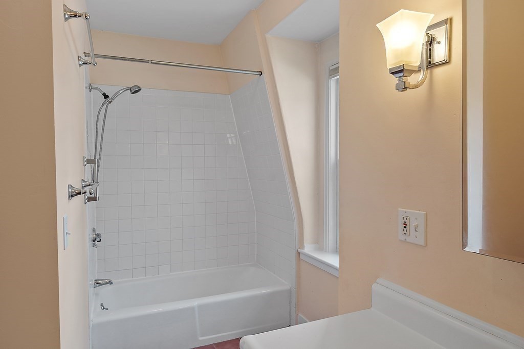 84 A Granite Street, Unit A Rockport, MA 01966 - Photo 20 of 40 a bathroom with a bathtub