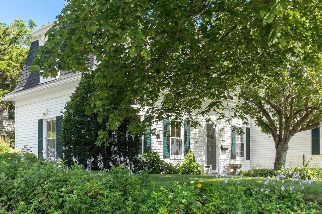 84 A Granite Street, Unit A Rockport, MA 01966 - Photo 2 of 40 front view of a house with a tree