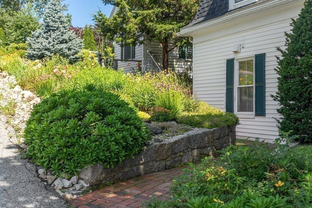 84 A Granite Street, Unit A Rockport, MA 01966 - Photo 24 of 40 a view of a backyard with plants