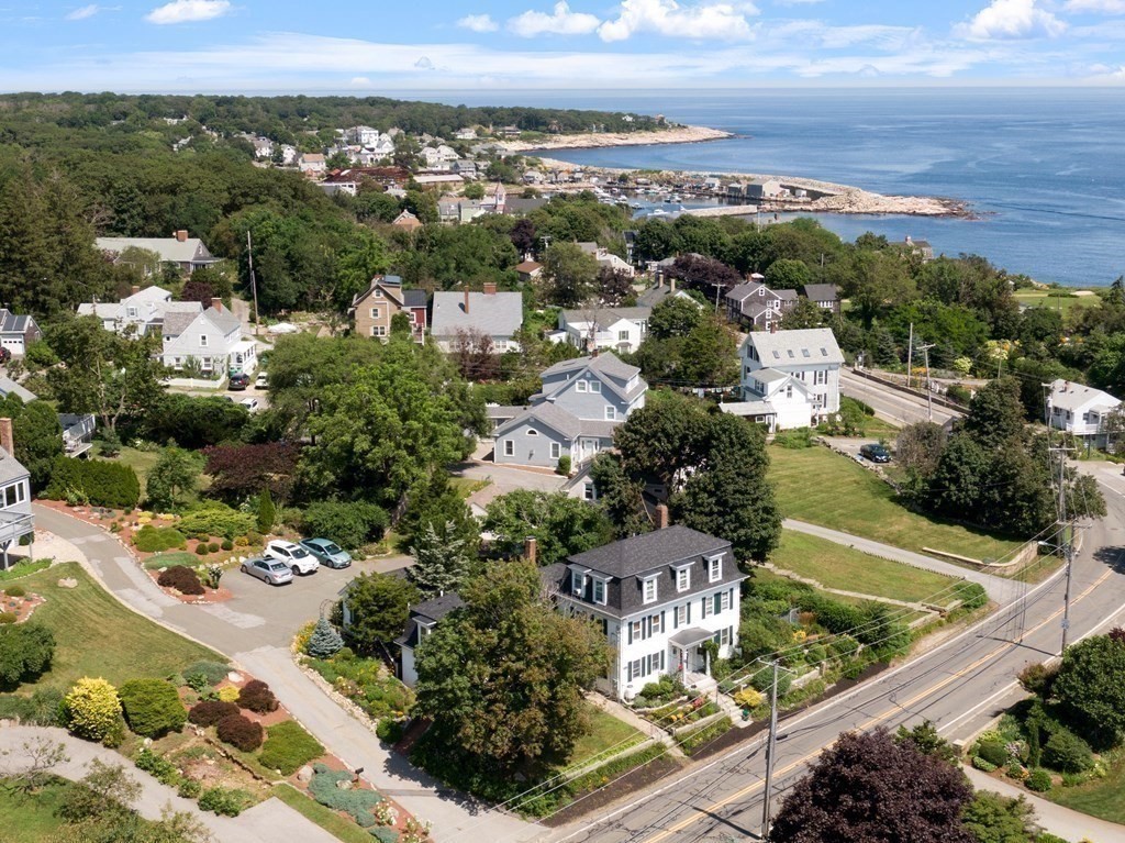 84 A Granite Street, Unit A Rockport, MA 01966 - Photo 29 of 40 an aerial view of residential houses with outdoor space