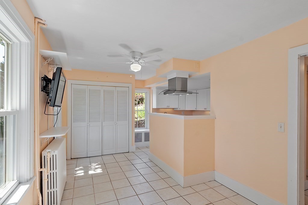 84 A Granite Street, Unit A Rockport, MA 01966 - Photo 4 of 40 a view of a kitchen with closet and electronic appliances