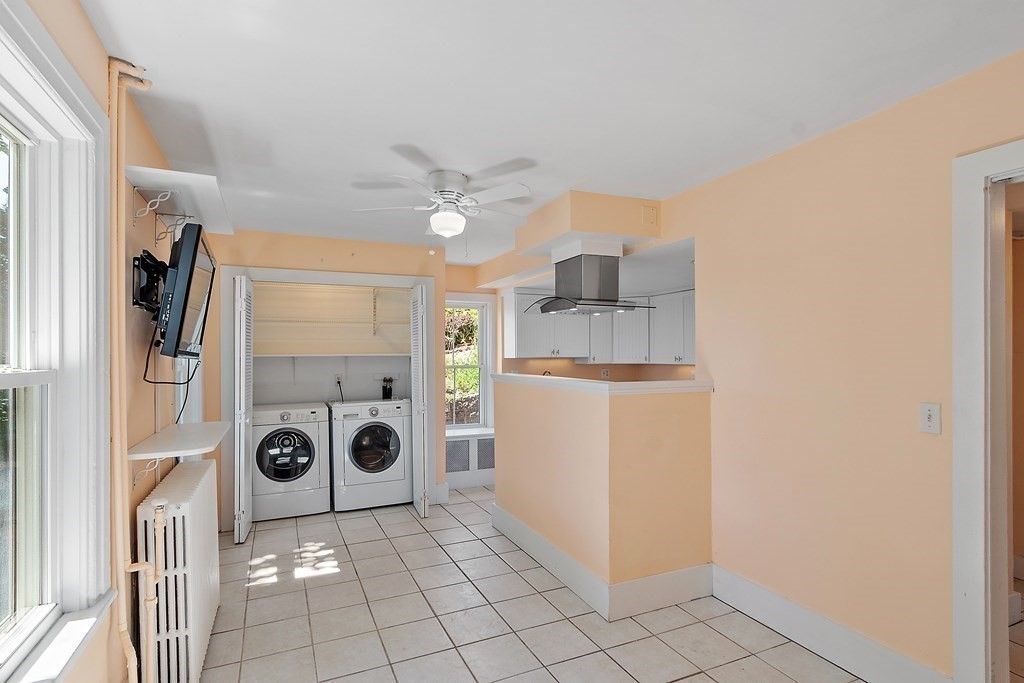 84 A Granite Street, Unit A Rockport, MA 01966 - Photo 5 of 40 a view of a storage & utility room with washer and dryer