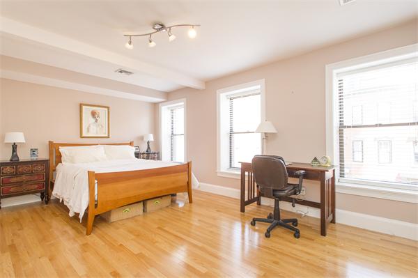 38 Worcester Street, Unit 3 Boston, MA 02118 - Photo 7 of 15 a bedroom with furniture and a window