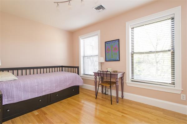 38 Worcester Street, Unit 3 Boston, MA 02118 - Photo 9 of 15 a bedroom with a bed and a window