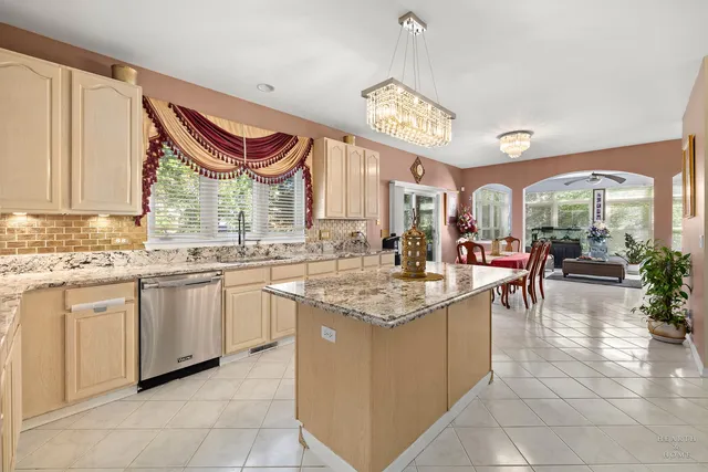 a kitchen with stainless steel appliances granite countertop a sink and cabinets