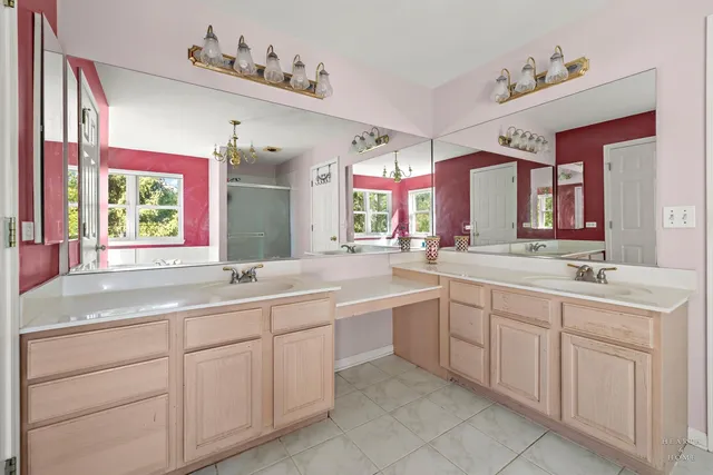 a bathroom with a sink vanity and mirror