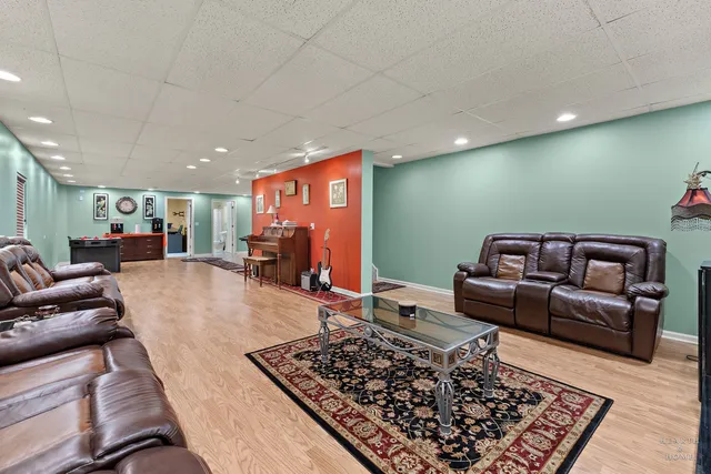 a living room with furniture and a rug