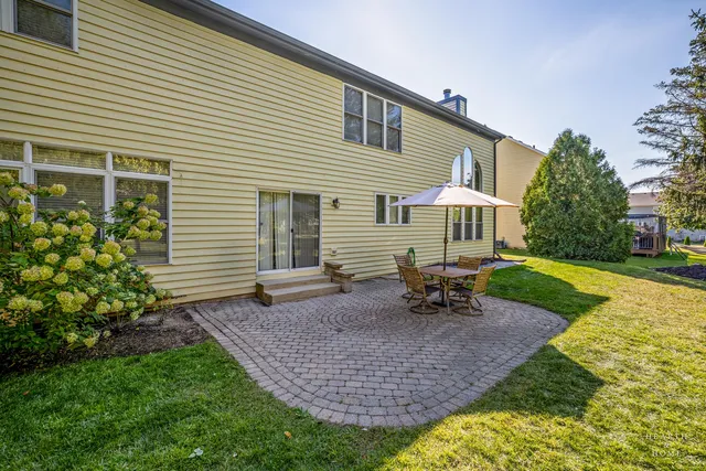 a view of a swimming pool with outdoor seating