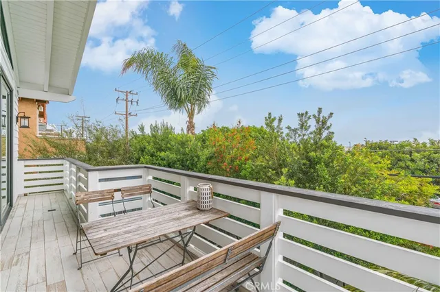 a view of a balcony with chairs