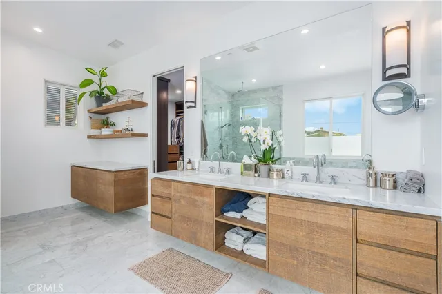 a bathroom with a double vanity sink and a mirror