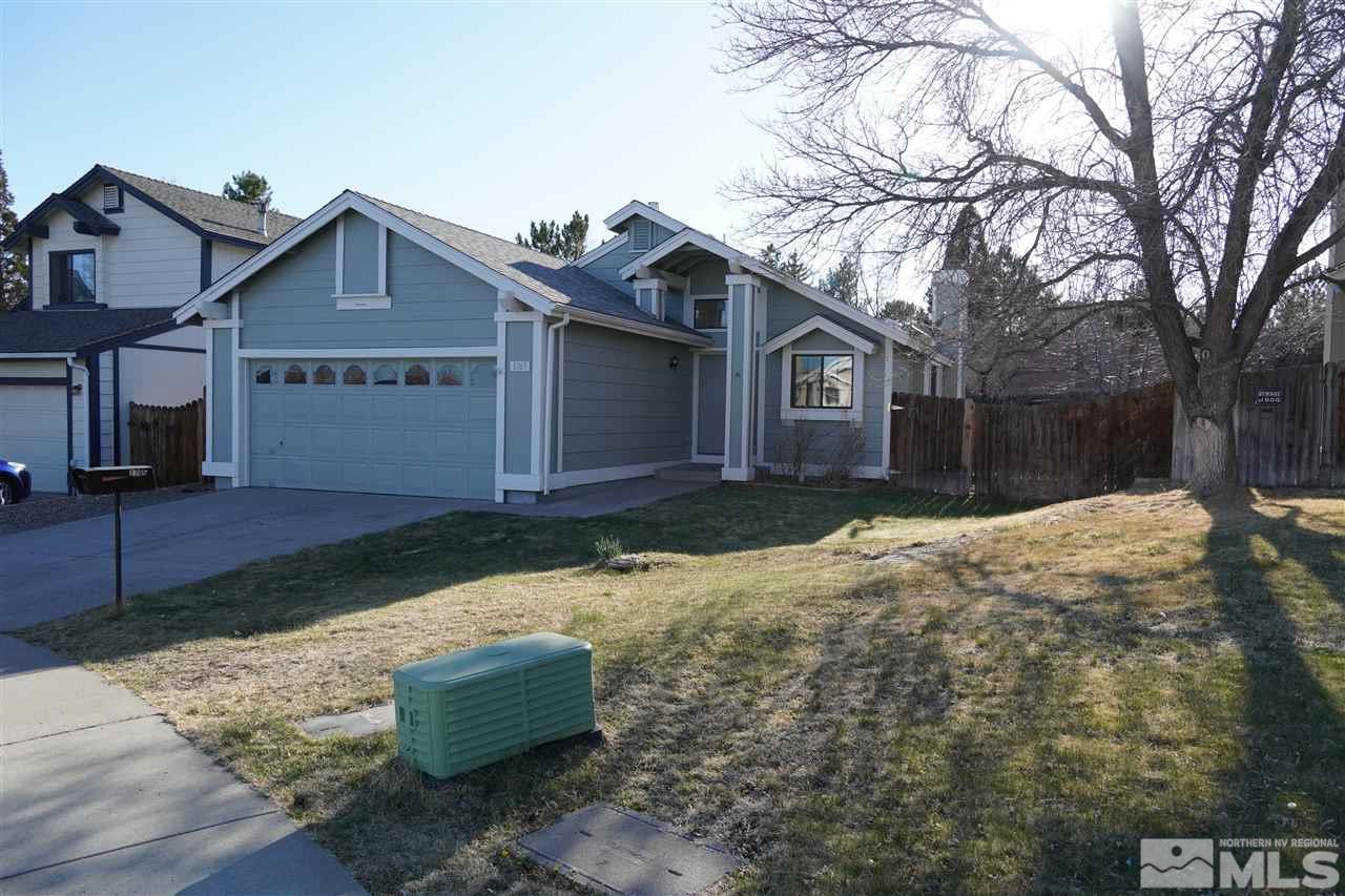 1765 Amarak Way Reno, NV 89523 - Photo 1 of 16 a front view of a house with a yard covered in snow