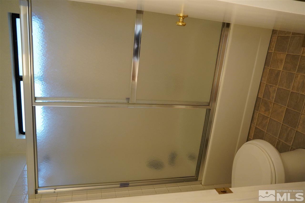 1765 Amarak Way Reno, NV 89523 - Photo 11 of 16 a bathroom with a shower and a toilet