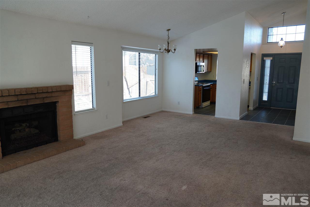 1765 Amarak Way Reno, NV 89523 - Photo 8 of 16 a view of empty room with windows and fireplace