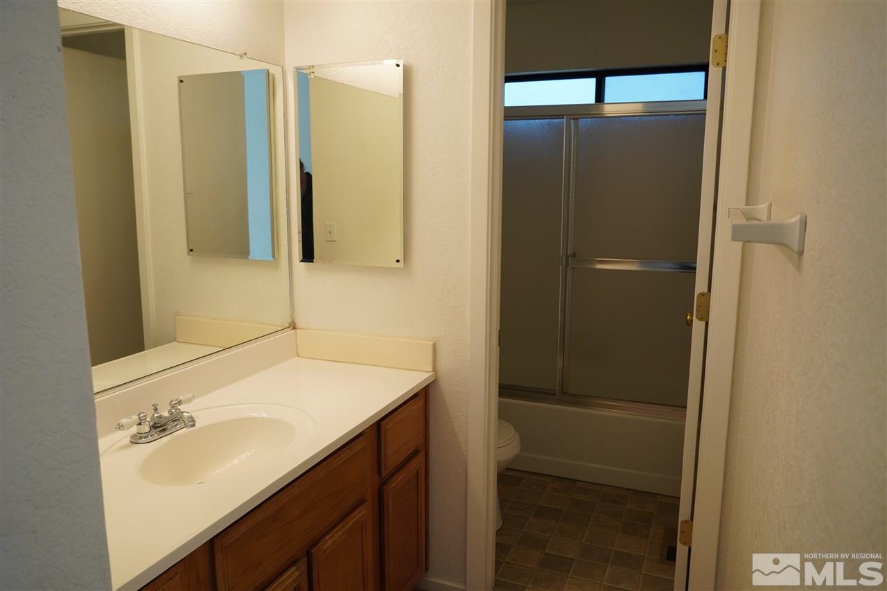 1765 Amarak Way Reno, NV 89523 - Photo 10 of 16 a bathroom with a sink and mirror