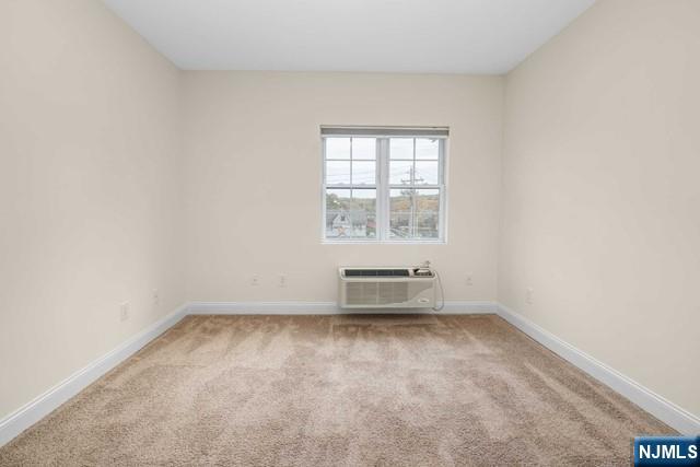 10 Madison, Unit 204 Cresskill, NJ 07626 - Photo 5 of 10 an empty room with a window