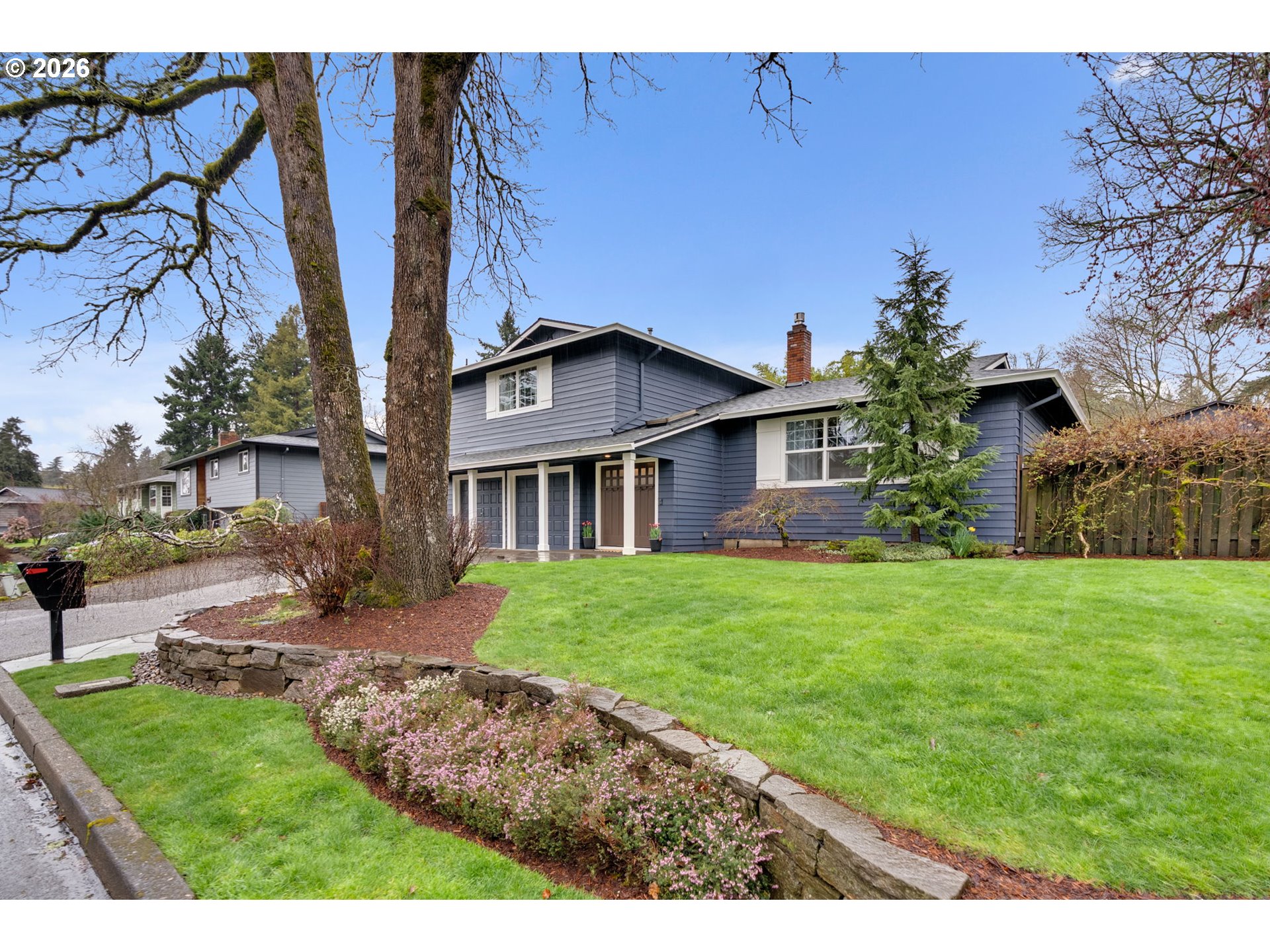 18370 Franklin Way Gladstone, OR 97027 - Photo 2 of 45 a front view of a house with a garden
