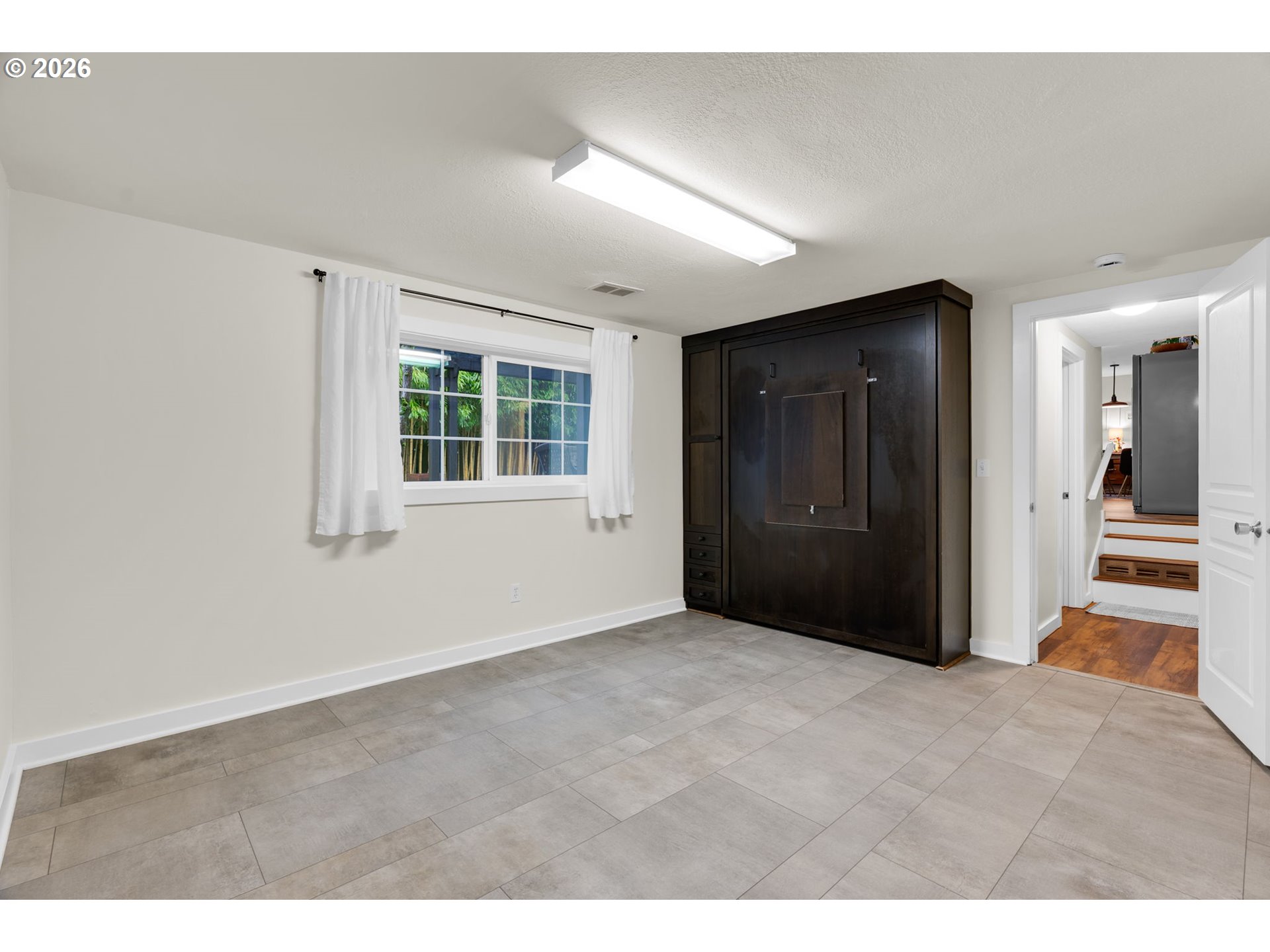 18370 Franklin Way Gladstone, OR 97027 - Photo 22 of 45 a view of an empty room with a window
