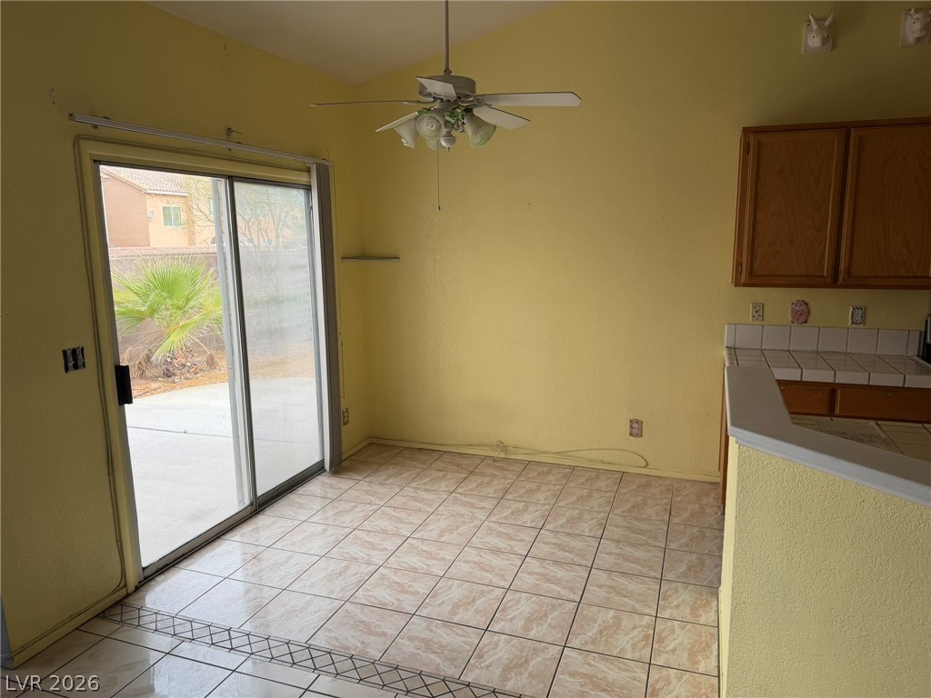 277 Gentle Bay Avenue Henderson, NV 89074 - Photo 7 of 43 This bright dining area features tiled flooring and convenient access to the outdoor space.