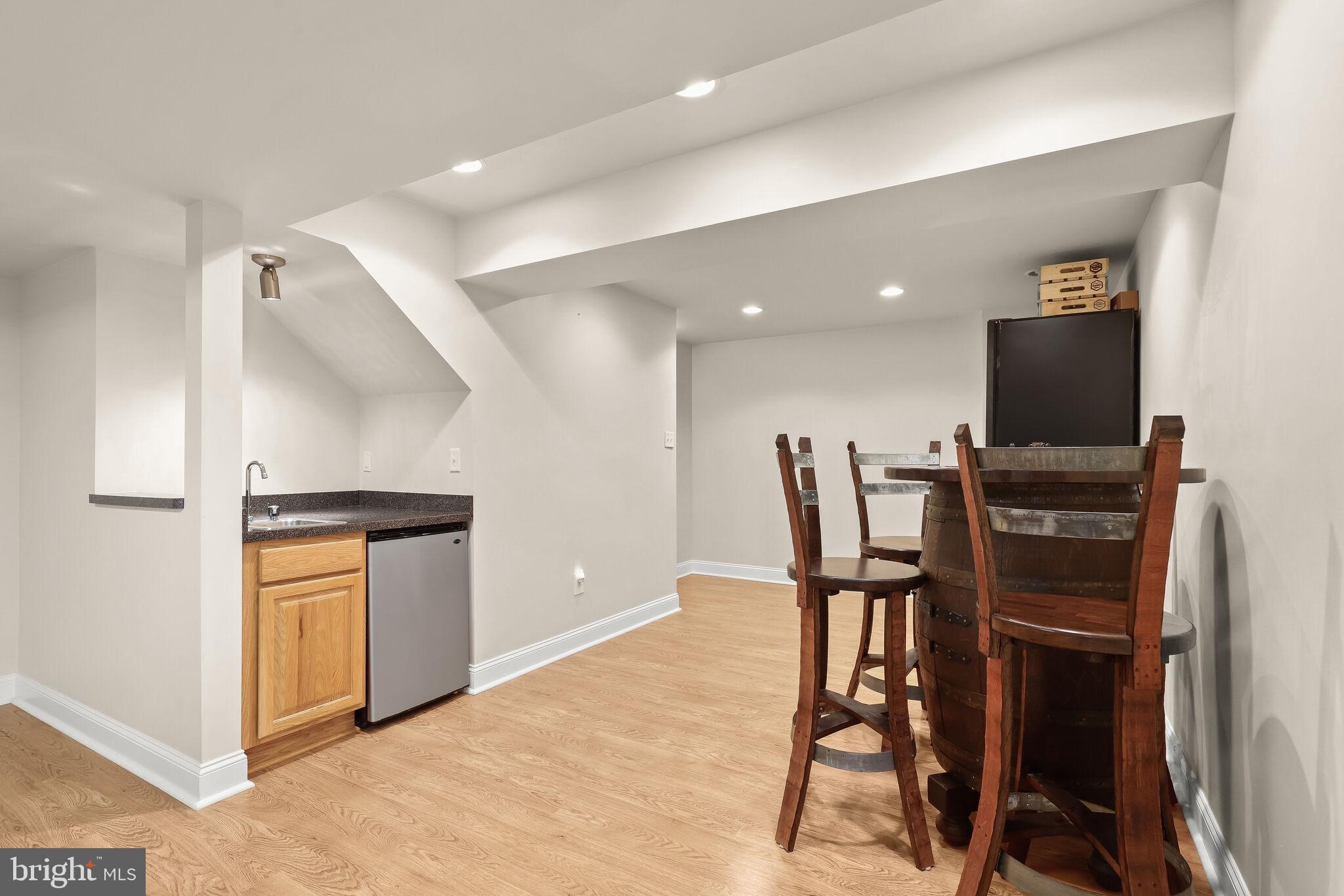 5911 Fall Moon Ride Clarksville, MD 21029 - Photo 39 of 65 Lower level recreation room with wet bar