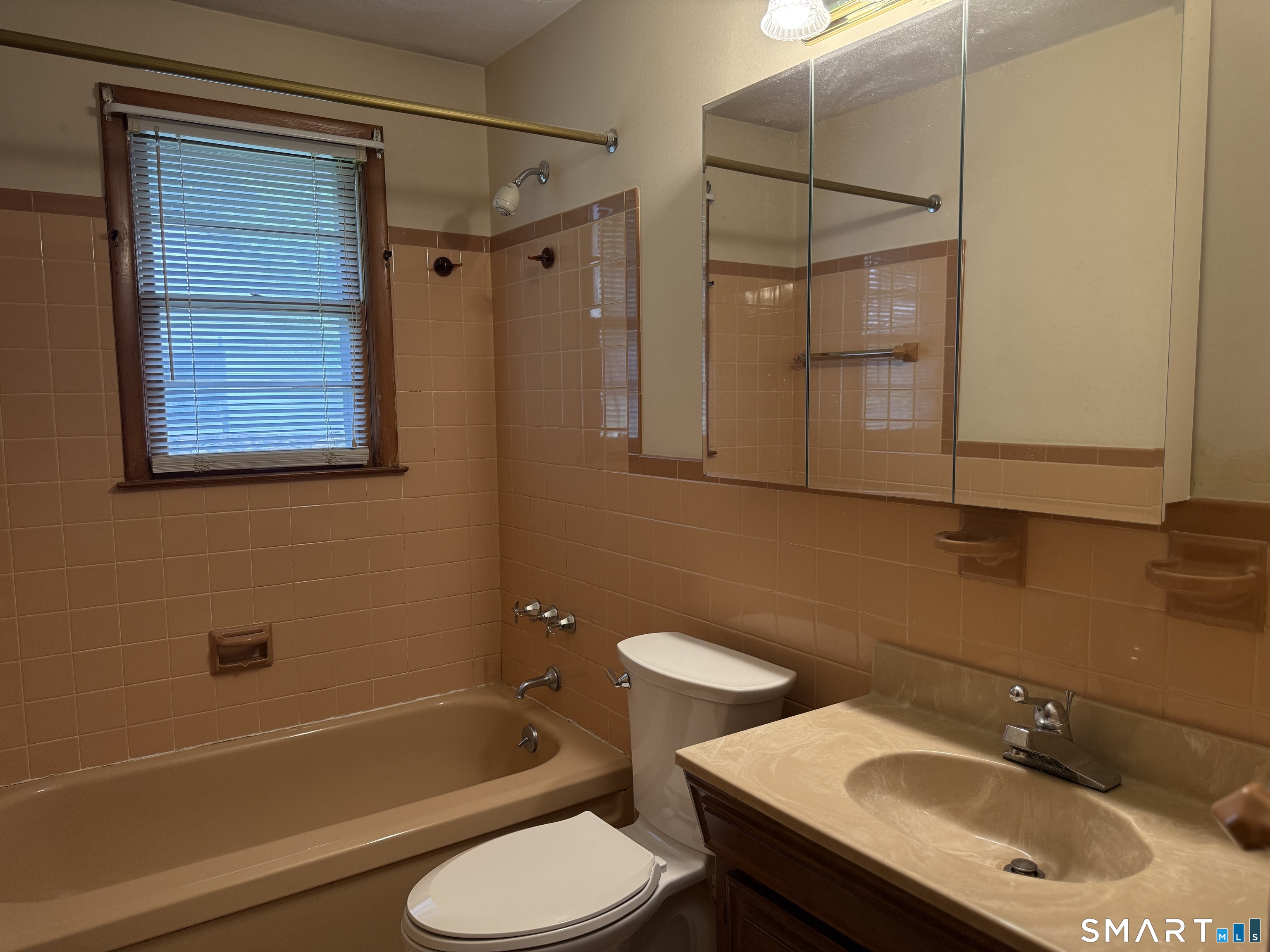 26 Maple Street Trumbull, CT 06611 - Photo 22 of 37 a bathroom with a sink toilet and shower