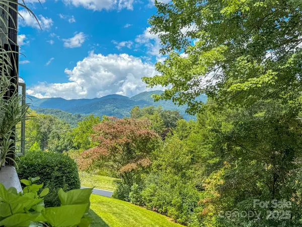 a view of a backyard of the house