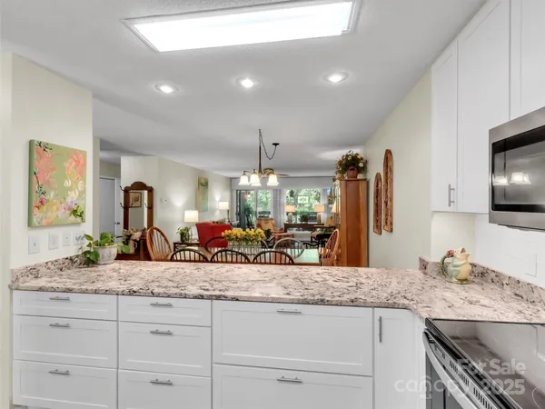 a bathroom with sink granite and a mirror