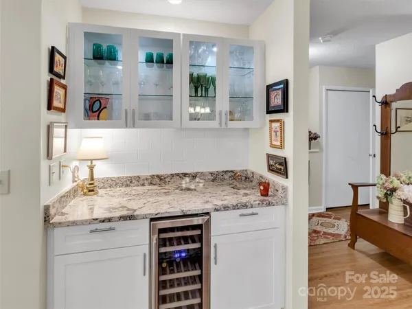 a kitchen with stainless steel appliances granite countertop a stove and a refrigerator