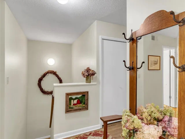 a picture of a bathroom with a shower and a mirror