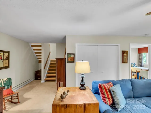 a bedroom with furniture and a lamp