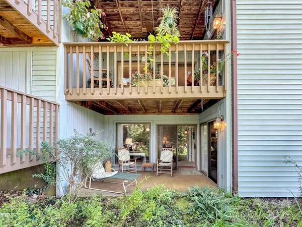 a front view of a house with a yard table and chairs