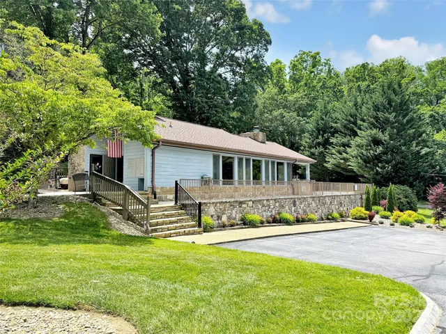 a view of a garden with a building in the background