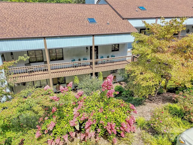 a picture of flowers in front of house