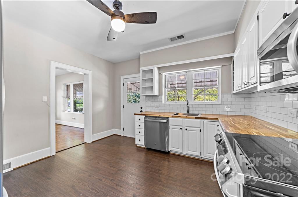 844 Lincolnton Road Salisbury, NC 28144 - Photo 13 of 36 a kitchen with a stove a sink and a refrigerator