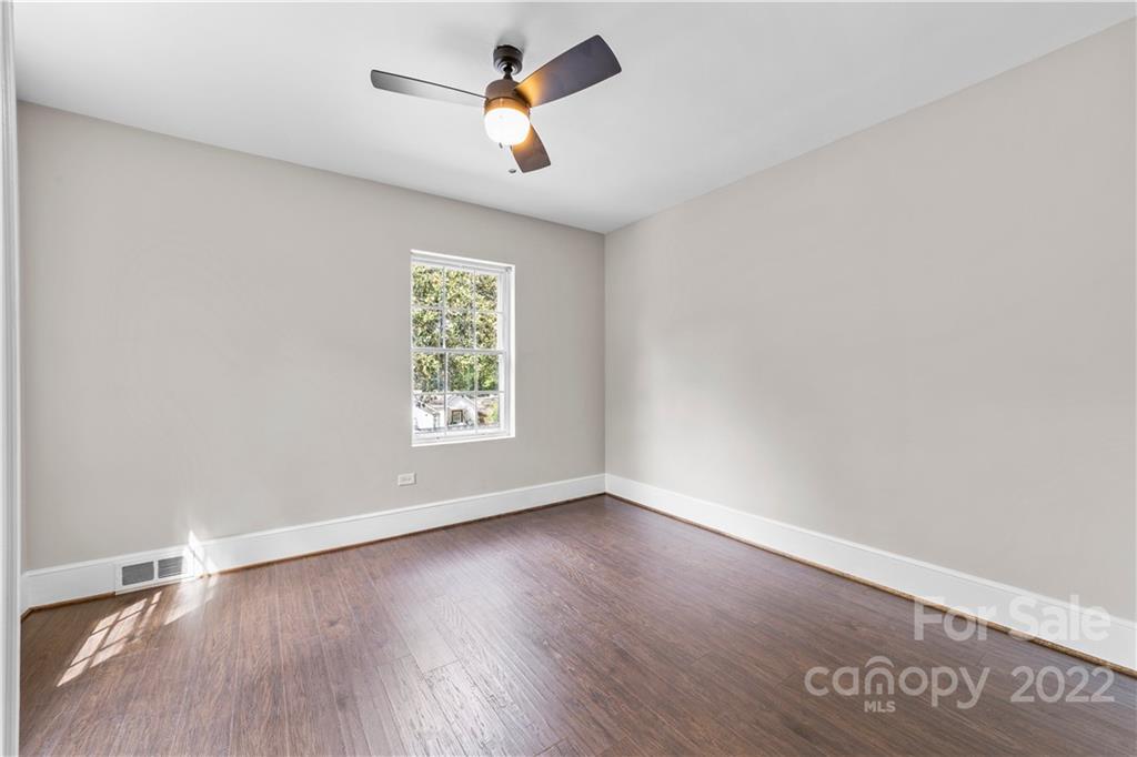 844 Lincolnton Road Salisbury, NC 28144 - Photo 16 of 36 an empty room with wooden floor and windows