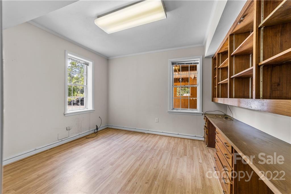 844 Lincolnton Road Salisbury, NC 28144 - Photo 27 of 36 a view of an empty room with wooden floor and a window