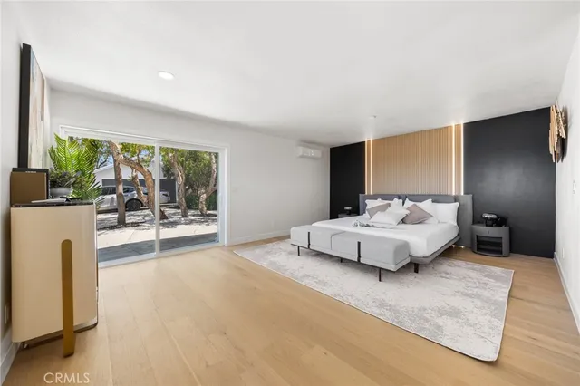 a bedroom with a bed and a night stand