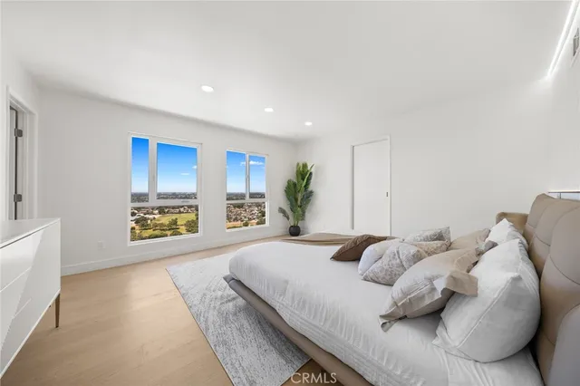 a bedroom with a bed and a cabinets