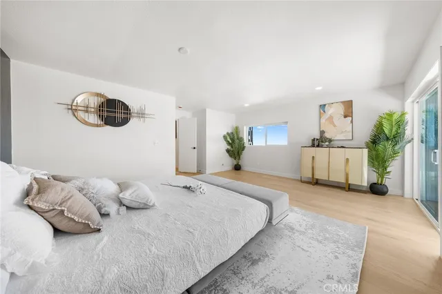 a bedroom with a bed and a couch