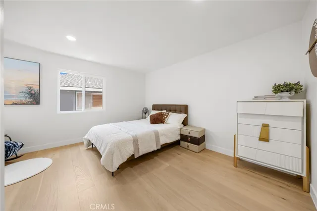 a bathroom with a double vanity sink toilet mirror and shower