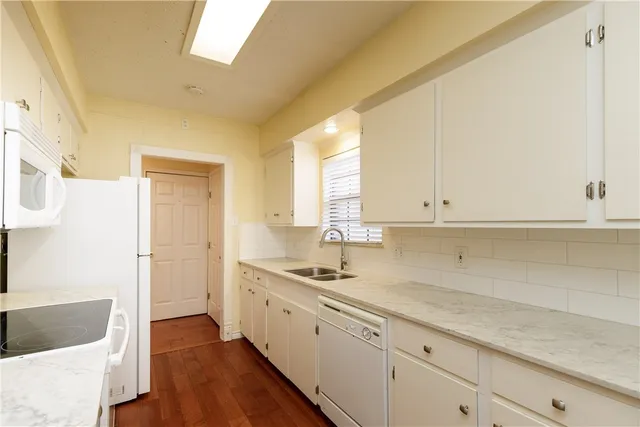 a kitchen with a sink and cabinets