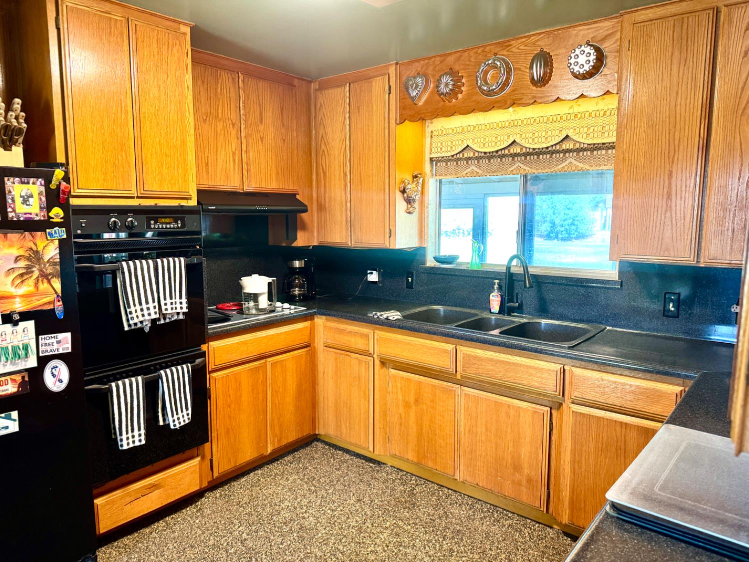 5476 Greenwood Avenue Clovis, CA 93619 - Photo 15 of 19 a kitchen with stainless steel appliances granite countertop a sink and a granite counter tops