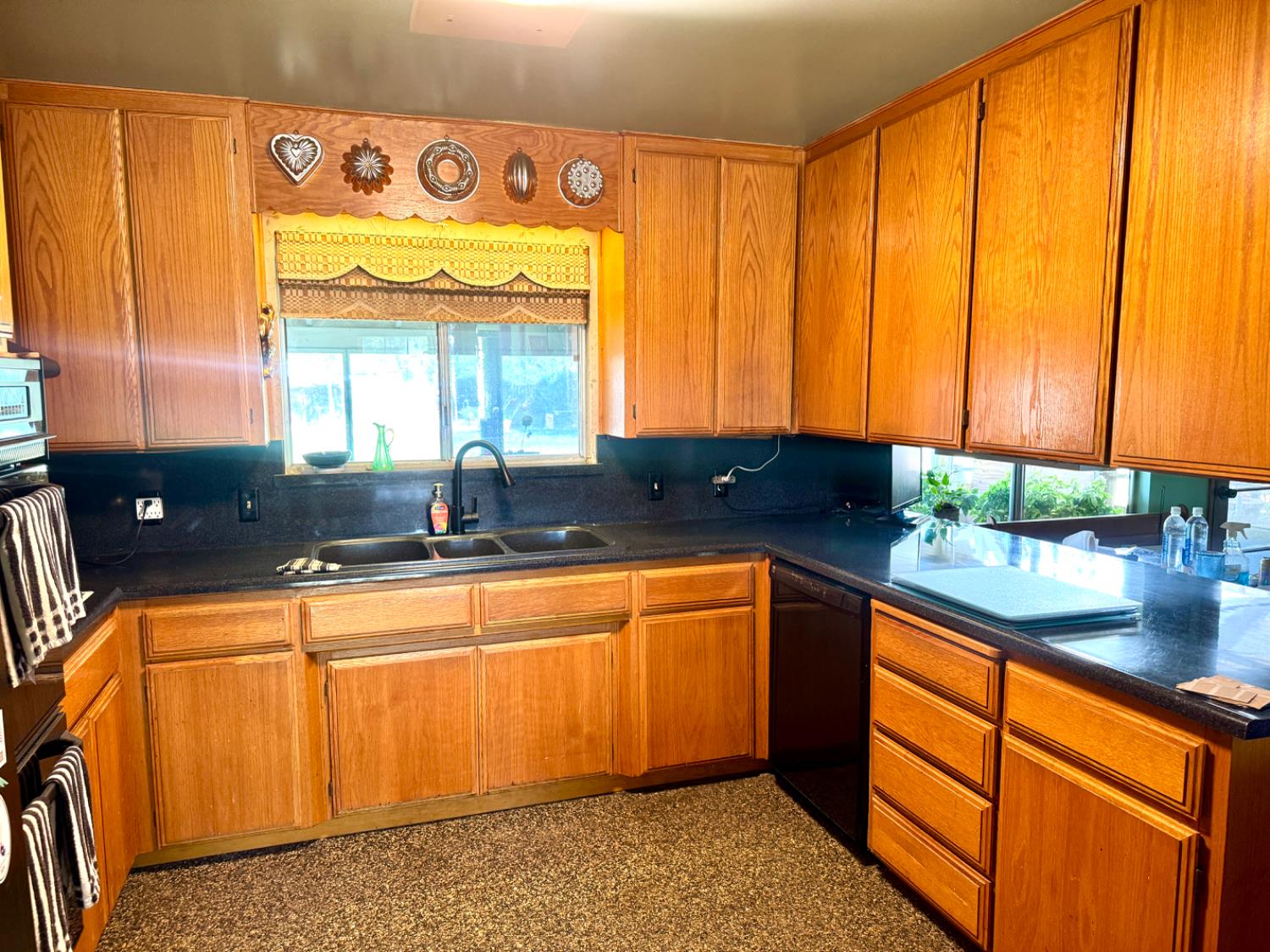 5476 Greenwood Avenue Clovis, CA 93619 - Photo 16 of 19 a kitchen with stainless steel appliances a sink and a large window
