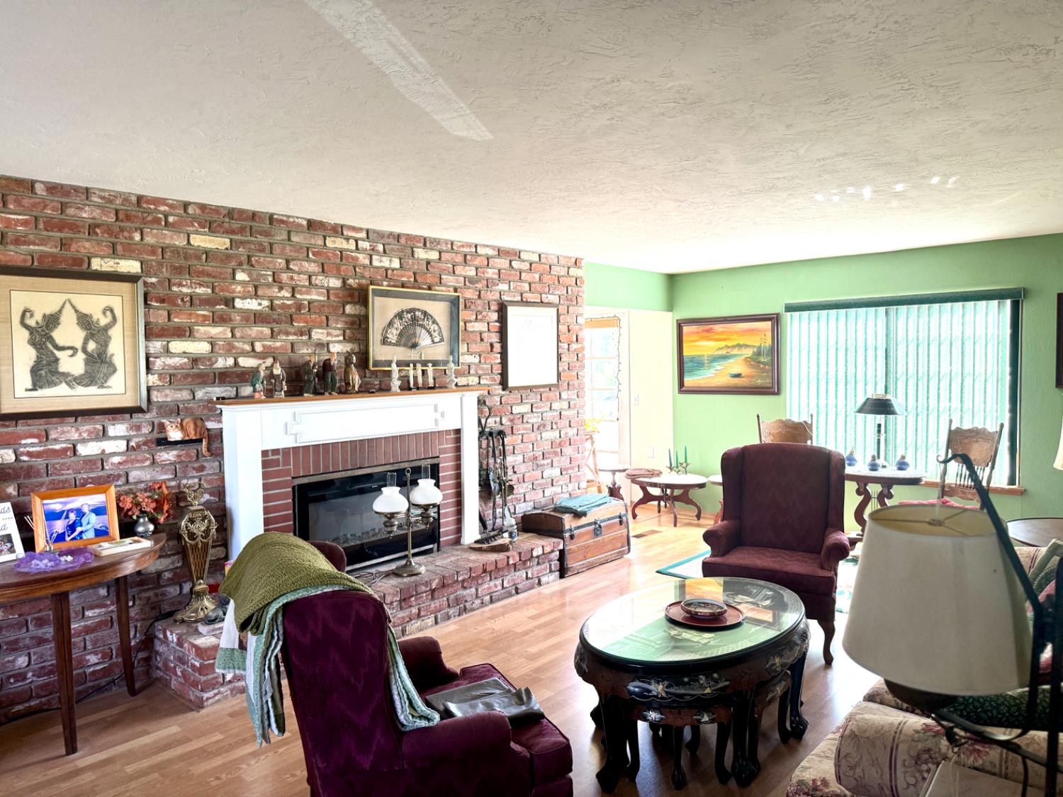 5476 Greenwood Avenue Clovis, CA 93619 - Photo 17 of 19 a living room with furniture a fireplace and a large window
