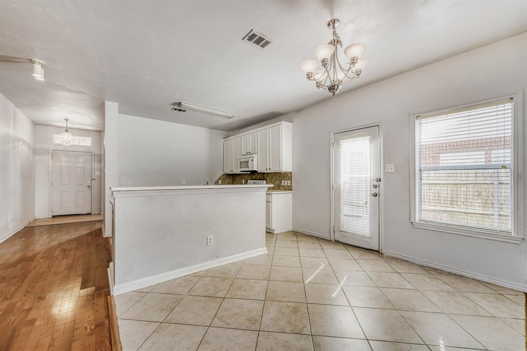 2617 Hereford Road Denton, TX 76210 - Photo 7 of 27 a view of a kitchen with a sink and a refrigerator