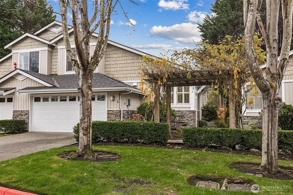 a front view of a house with a yard