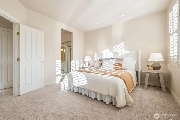 a bedroom with bed and window