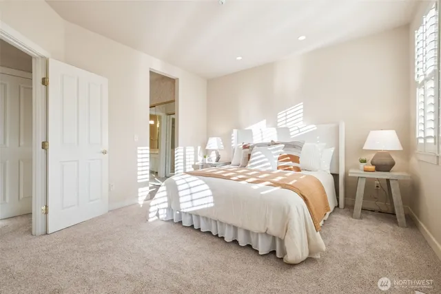 a bedroom with bed and window